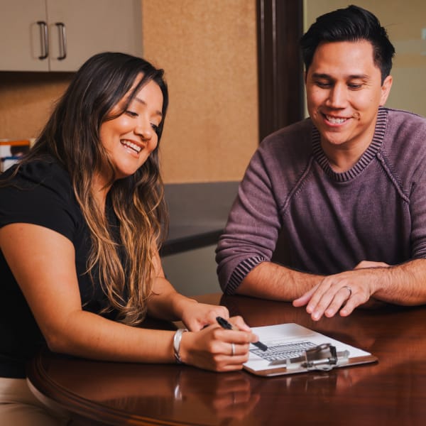 North County Dental Arts staff member chatting with a patient